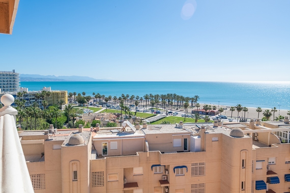 a view of the ocean from a hotel balcony