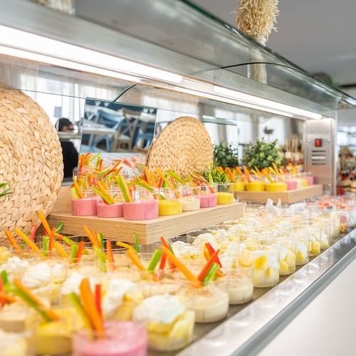 a buffet line filled with a variety of desserts