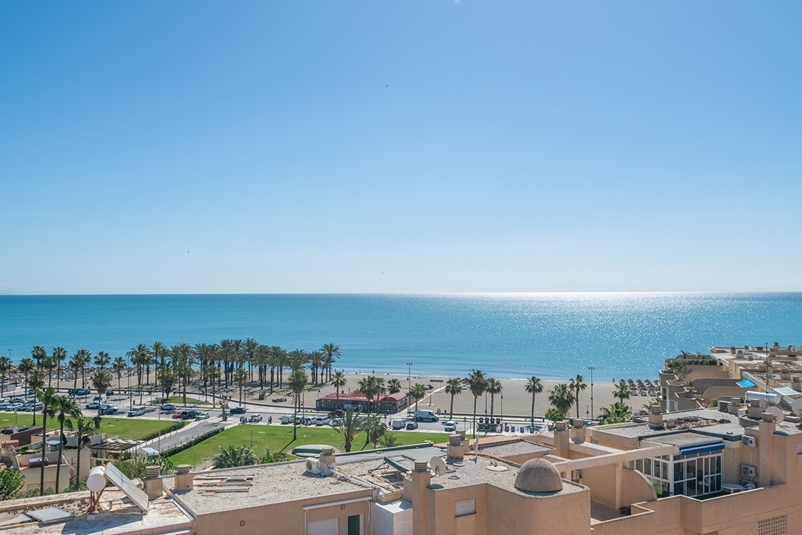 a view of the ocean from the roof of a building