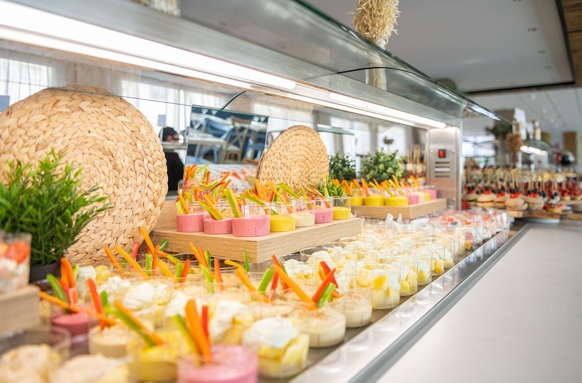 a buffet line filled with a variety of desserts