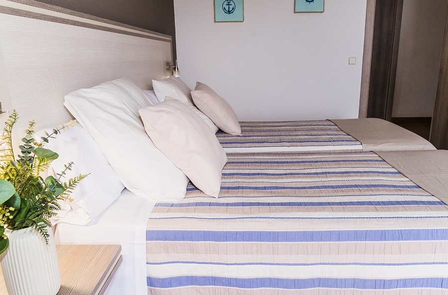 a hotel room with two beds and a desk