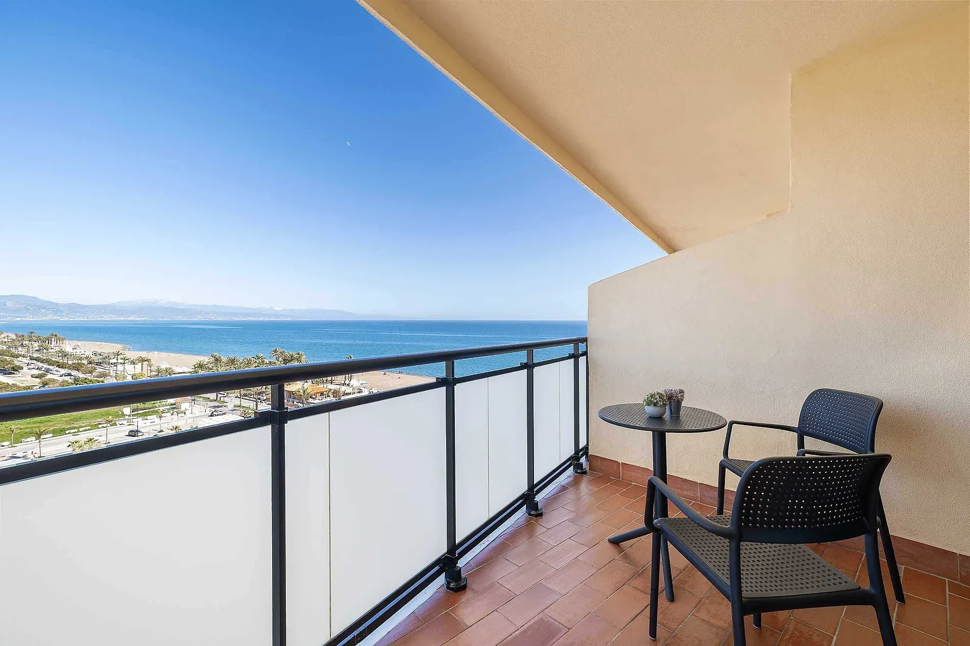 Seaside balcony at Hotel Puente Real **** Torremolinos, with table and chairs.