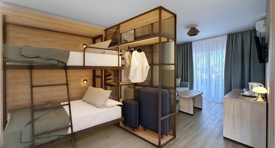 a room with bunk beds and a suitcase in it