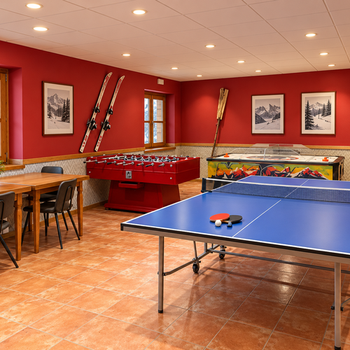 SNO: Hotel Vall de Boi game room with foosball and ping pong.