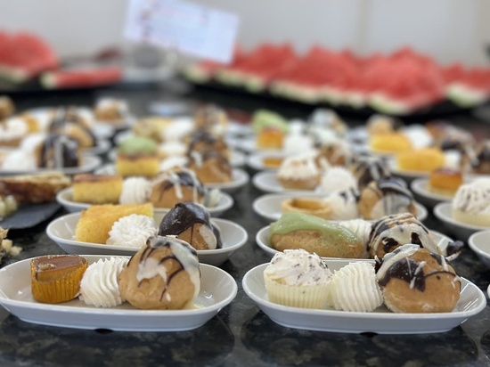 a variety of desserts are on plates on a table