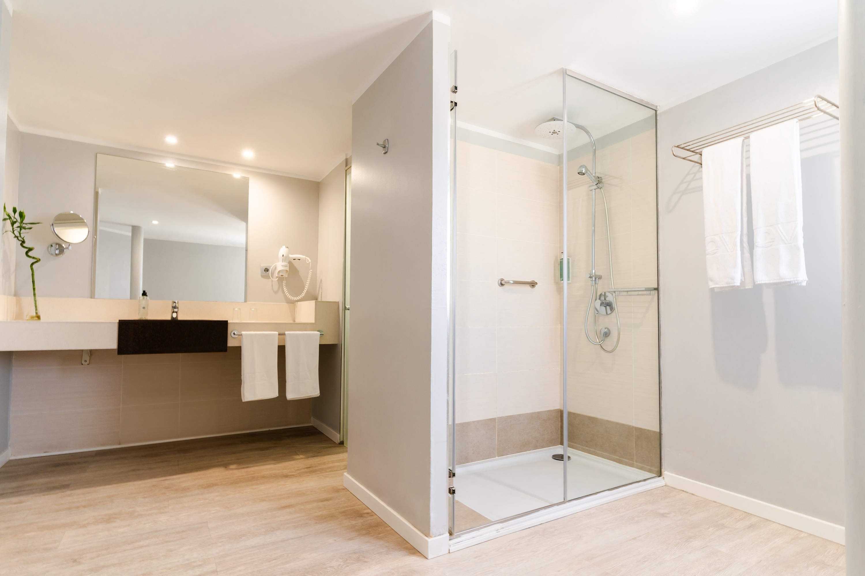 a bathroom with a sink and a walk in shower