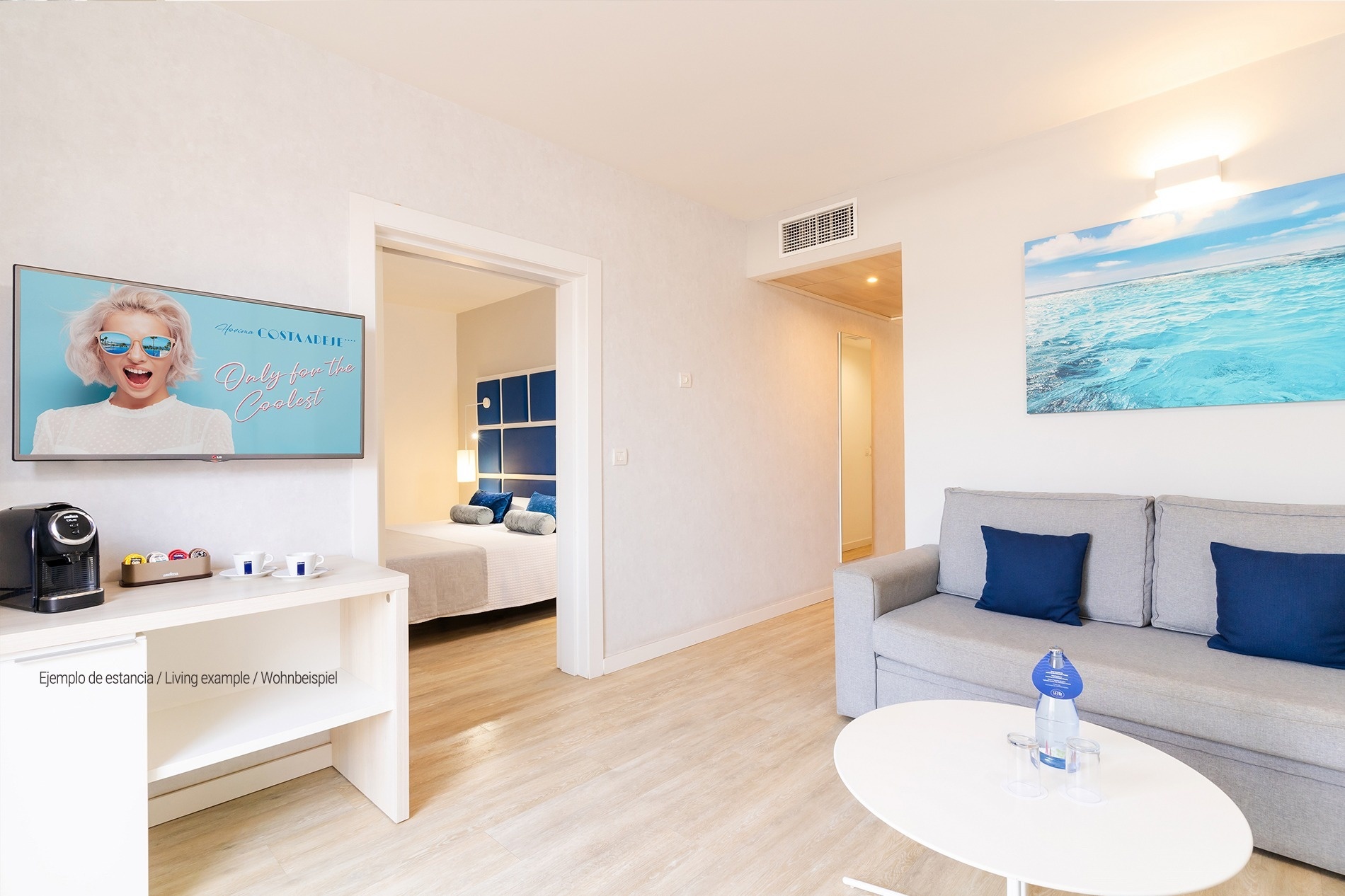 a living room with a couch and a flat screen tv that says only for the coolest