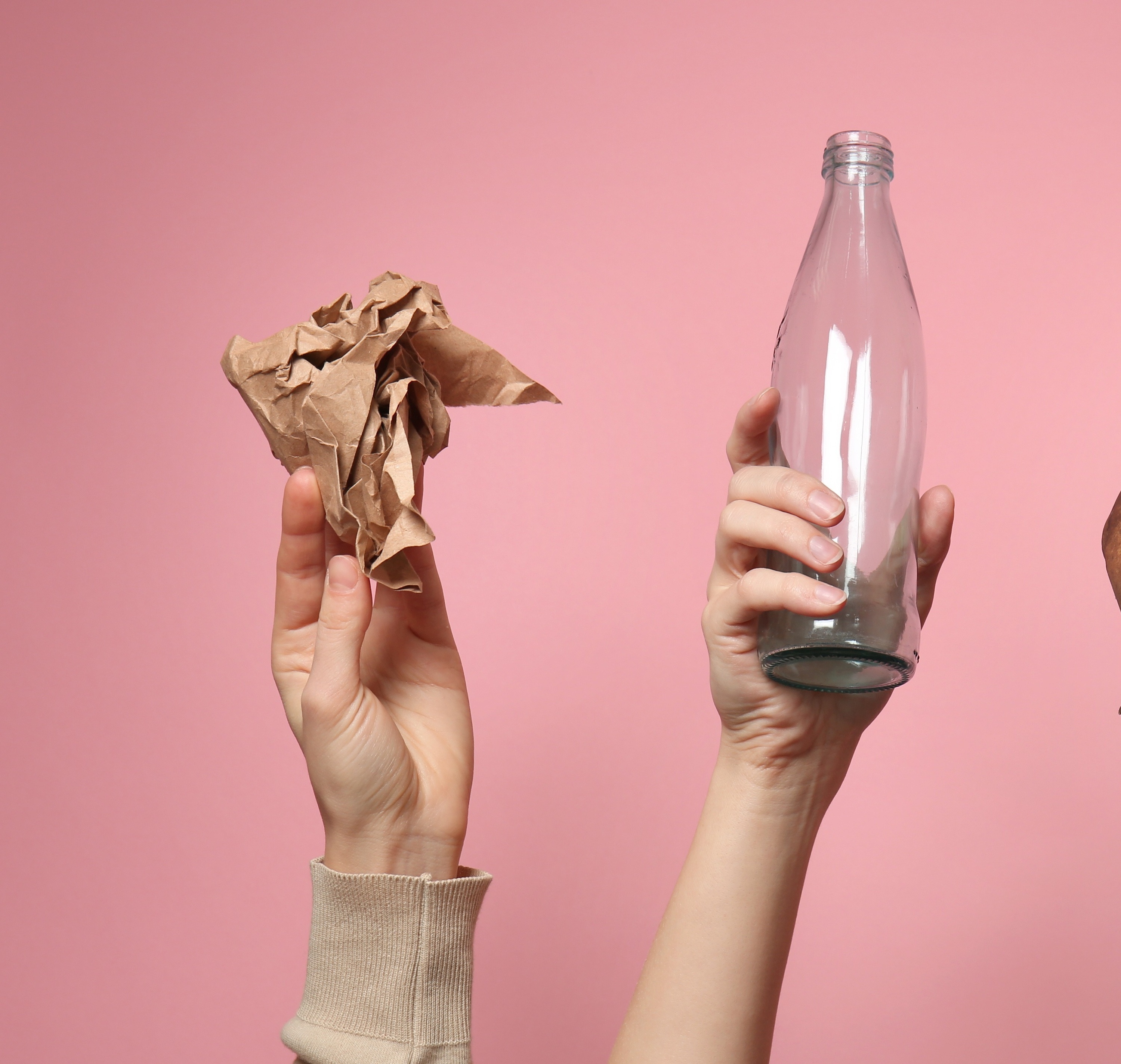 a group of people are holding up different types of objects