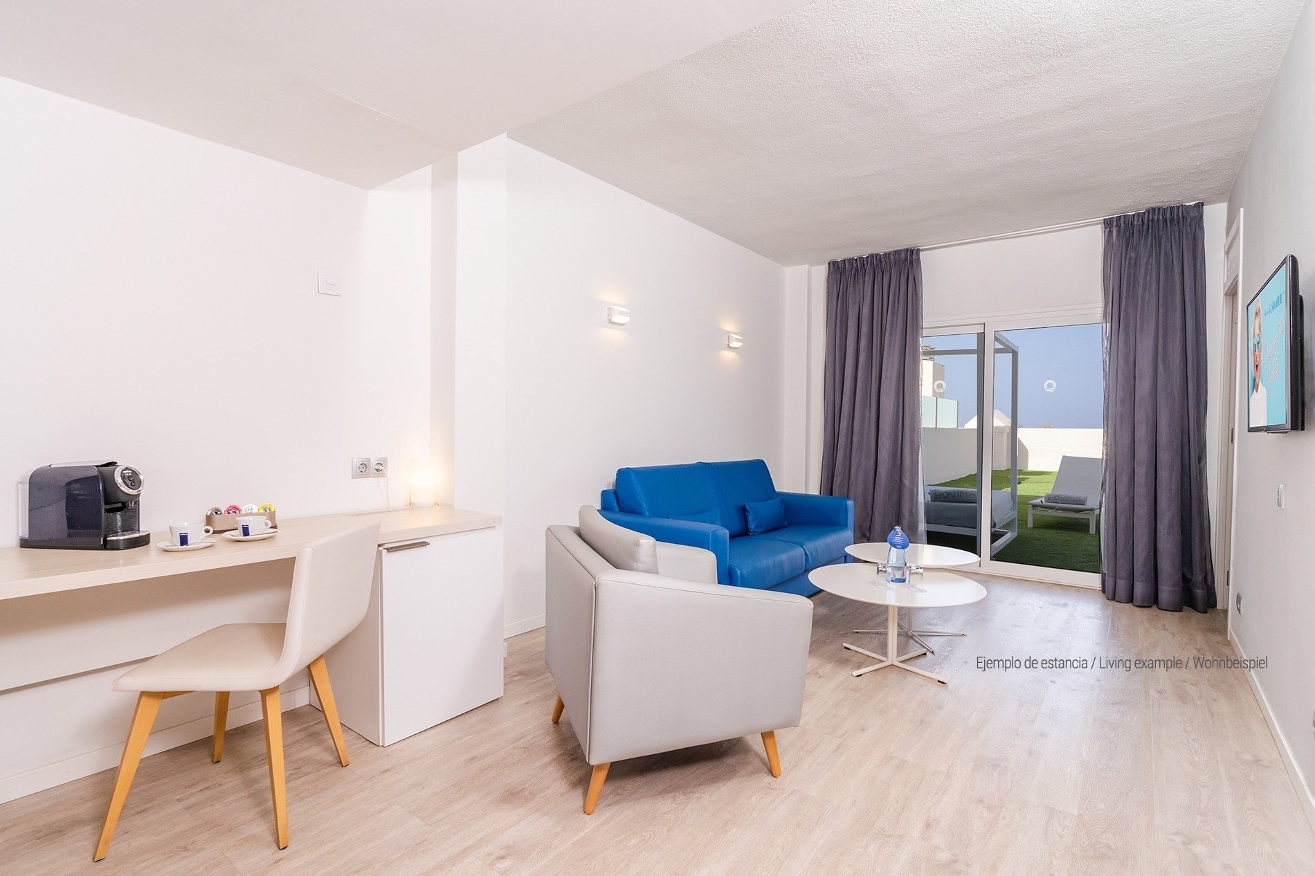 a hotel room with a bed and a sign that says hovim