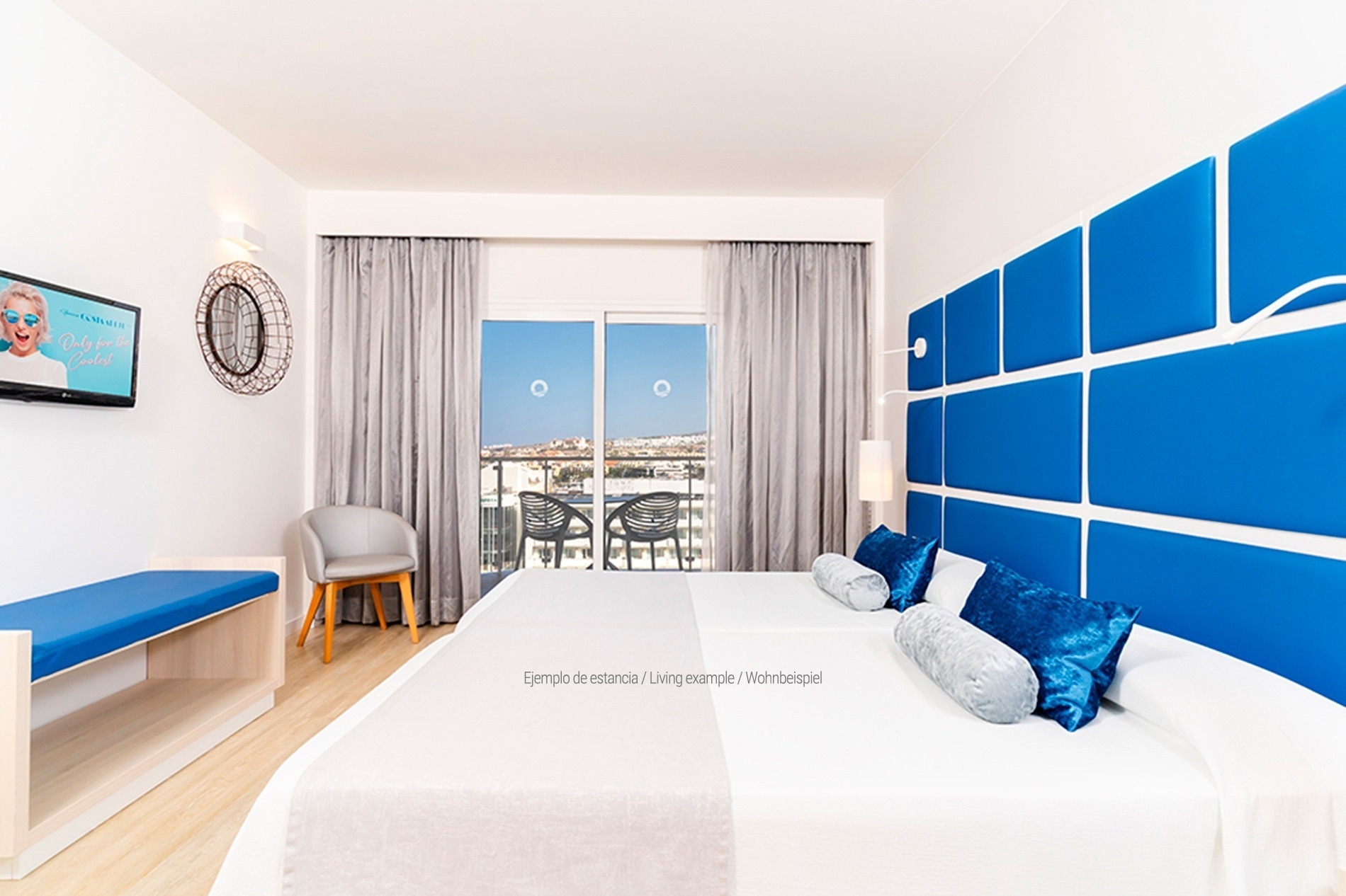 a hotel room with a bed and a sign that says hovim