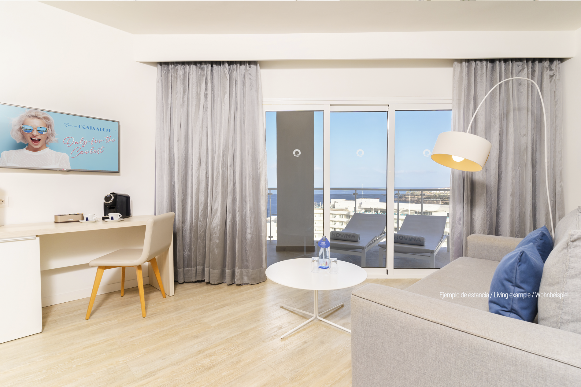 a hotel room with a bed and a sign that says hovim