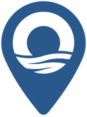 un pin azul con un sol y olas en él