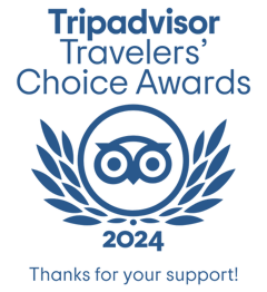 a white traveler 's choice tripadvisor logo on a black background .