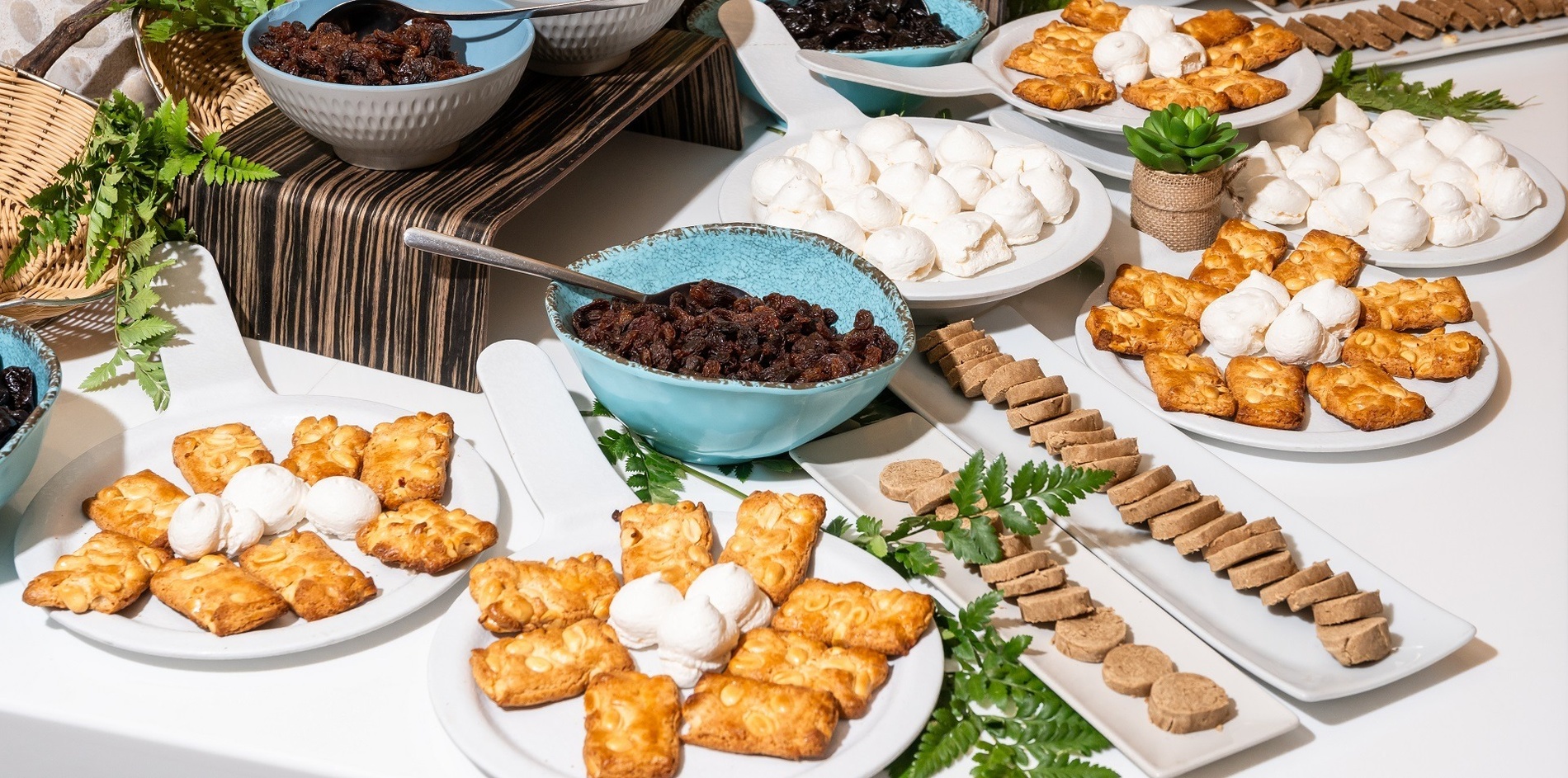 a buffet line with a bottle of meyer lemon dressing