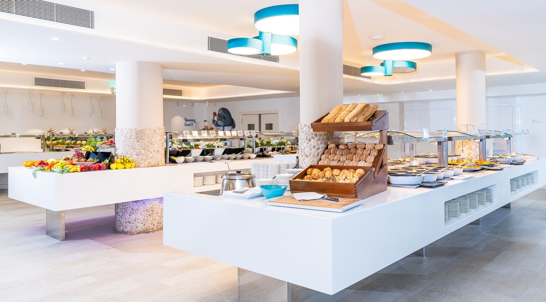 a buffet line with a bottle of meyer lemon dressing