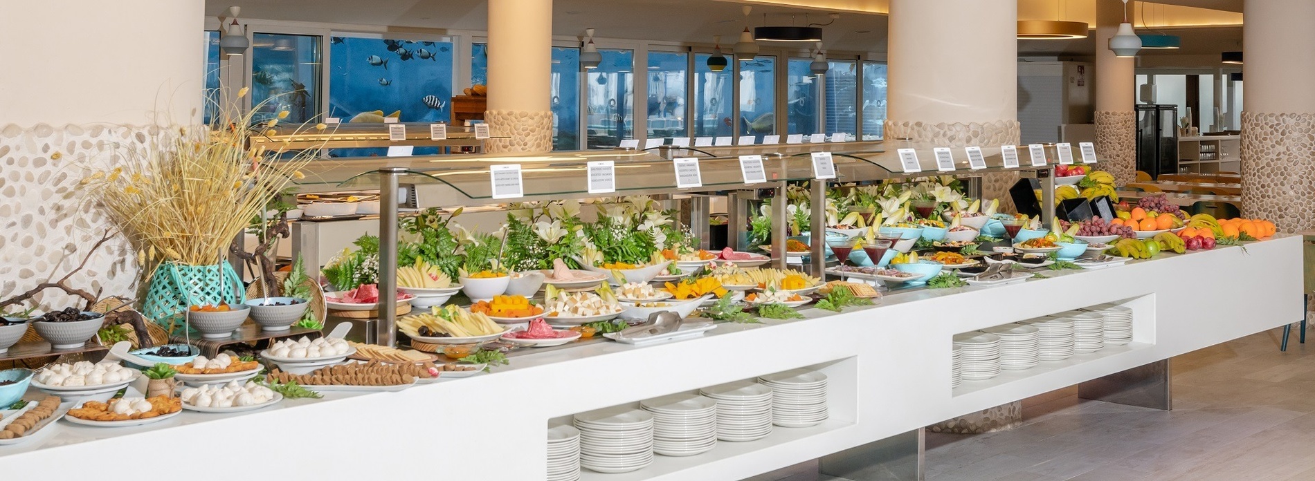 a buffet line with a bottle of meyer lemon dressing