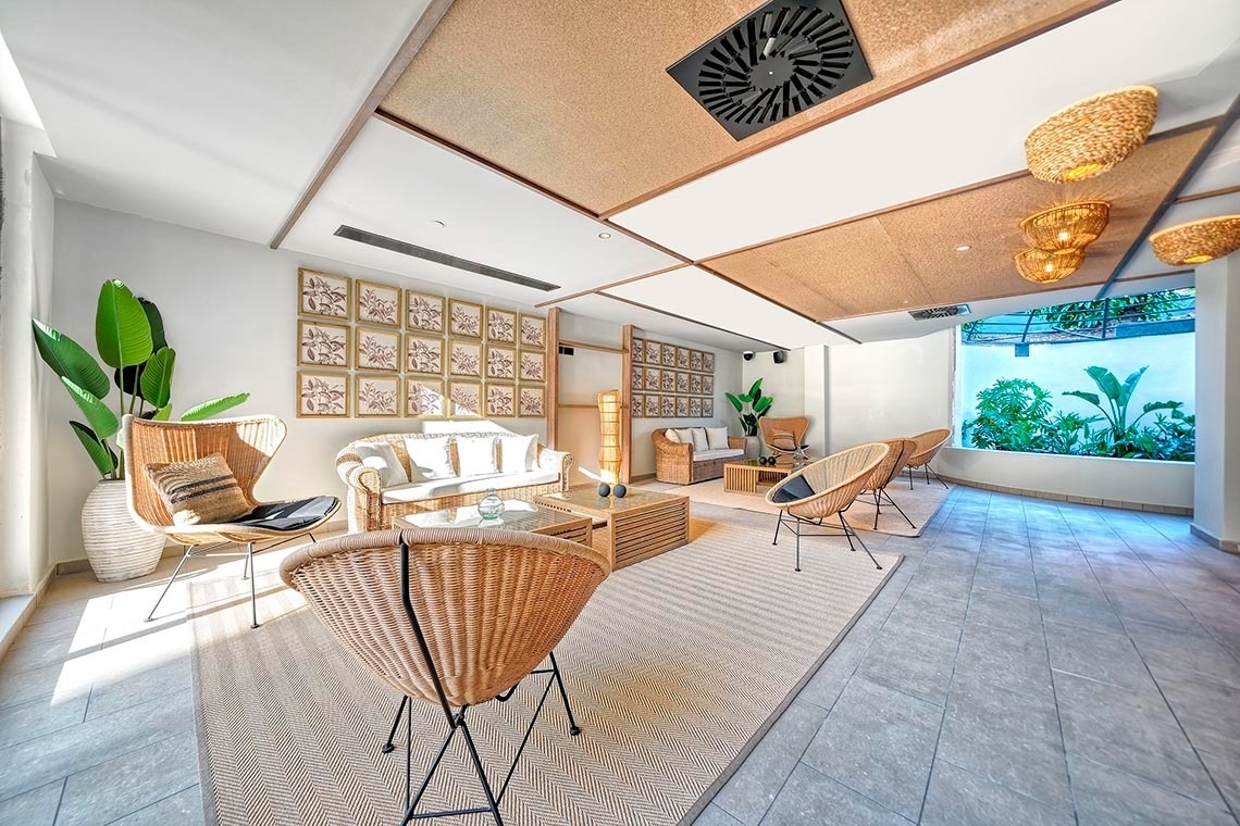 a green heart shaped leaf on a sandy beach