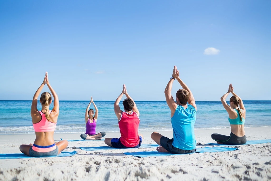 two men playing golf with mountains in the background