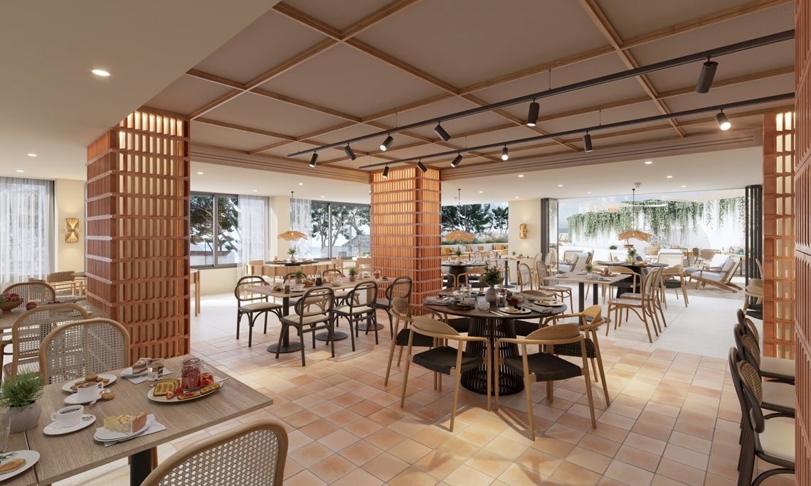 
                                    un restaurante con mesas y sillas con vista al océano