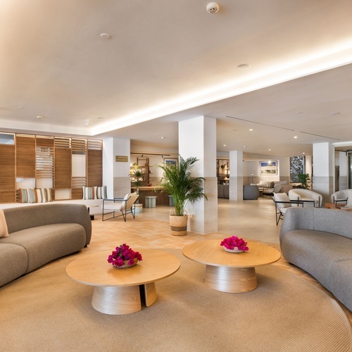 a living room with a couch and two coffee tables