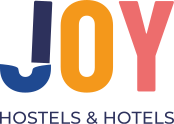 JOY: Corporativa. Logo color sobre fondo negro. Hotel y hostal