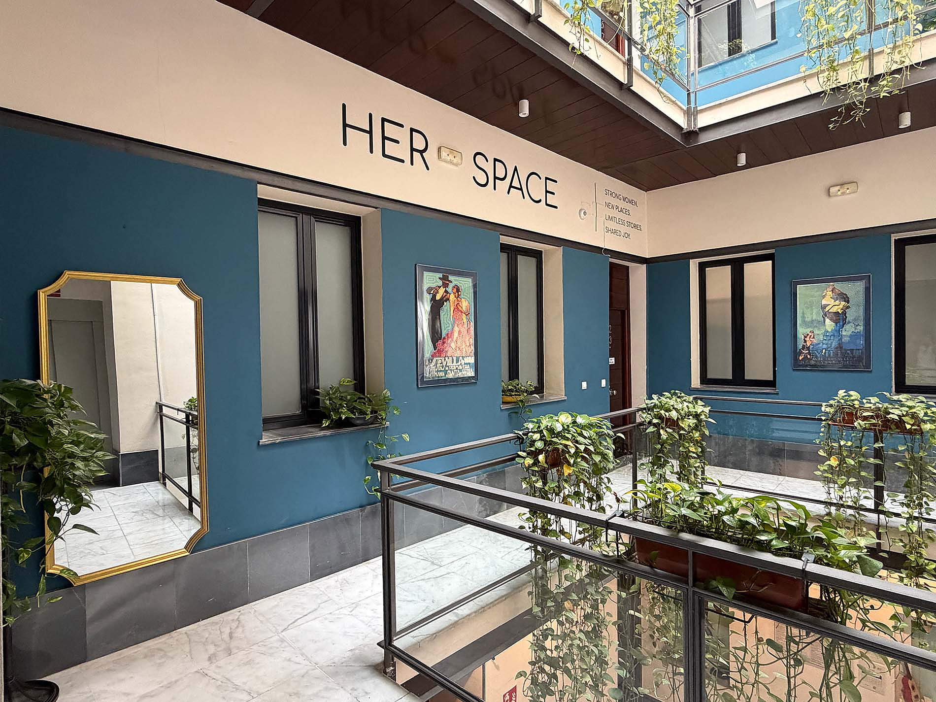 Her Space: A welcoming hotel interior with plants and art, perfect for your JOY: Corporativa.