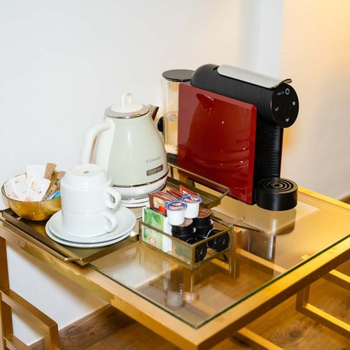 Coffee and tea station with Nespresso machine and kettle, perfect for a Juderia: Cordoba stay.