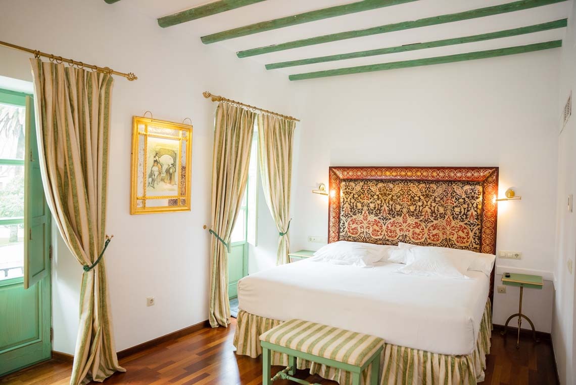 Classic bedroom with canopy bed and views of Cordoba's Judería.