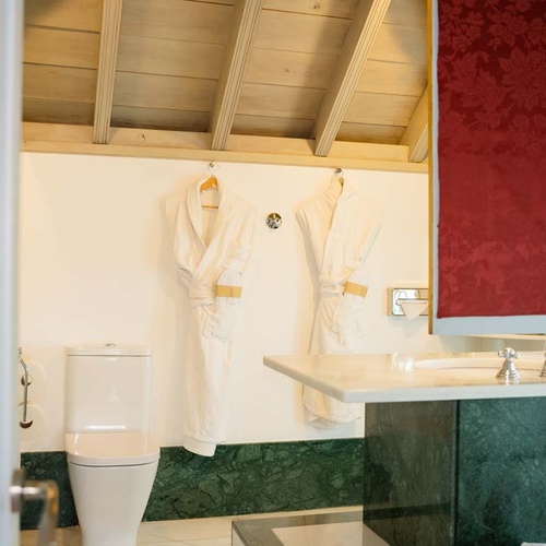 Luxury bathrobes hanging in a hotel bathroom in Juderia, Cordoba.