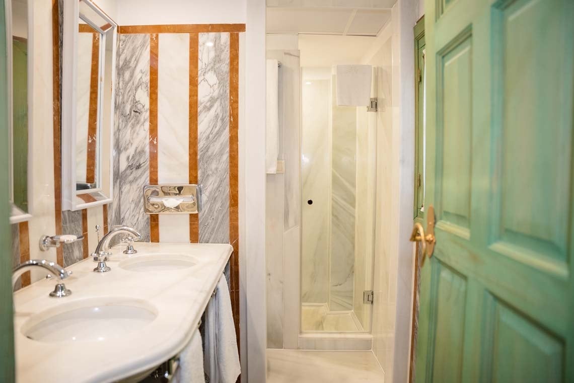 Luxury bathroom in Juderia: Cordoba with marble, dual sinks, and shower.