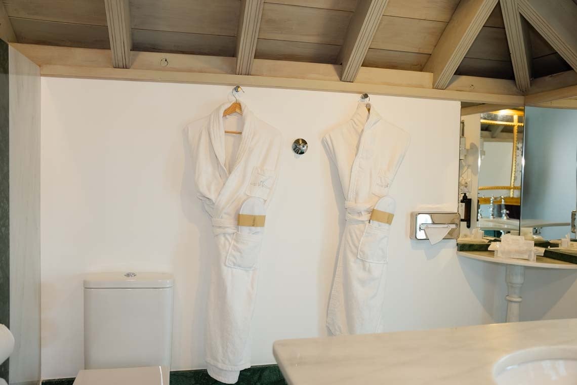 Juderia: Cordoba hotel bathroom with plush robes and slippers.