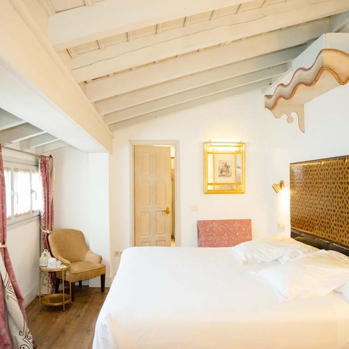 Elegant bedroom in Juderia: Cordoba, with plush bedding and chic decor.