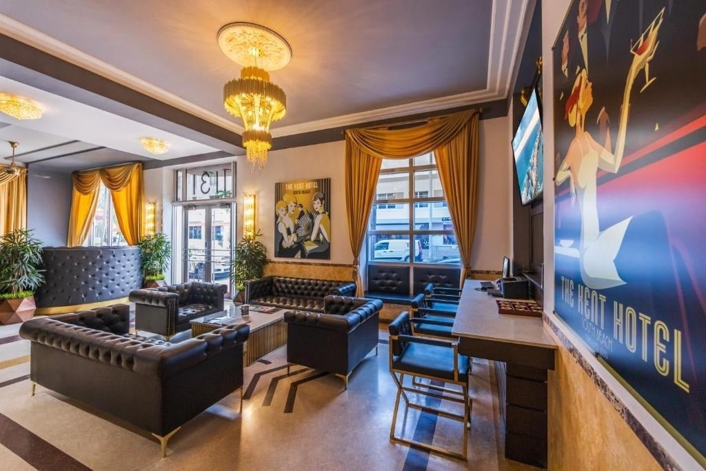 a hotel lobby with a poster on the wall that says the best hotel