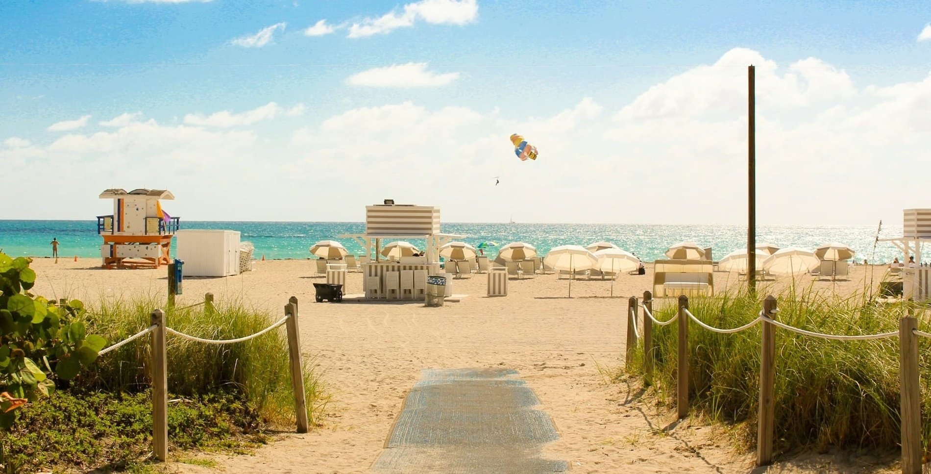 a beach with a lifeguard tower in the foreground