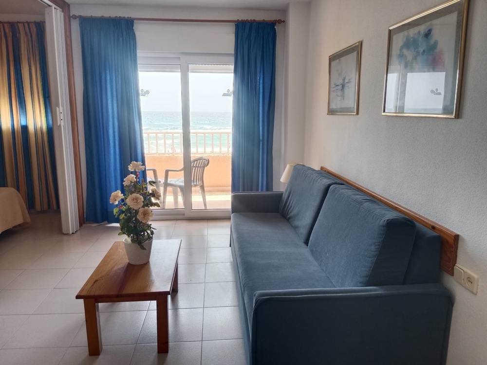 a hotel room with a bed and sea views