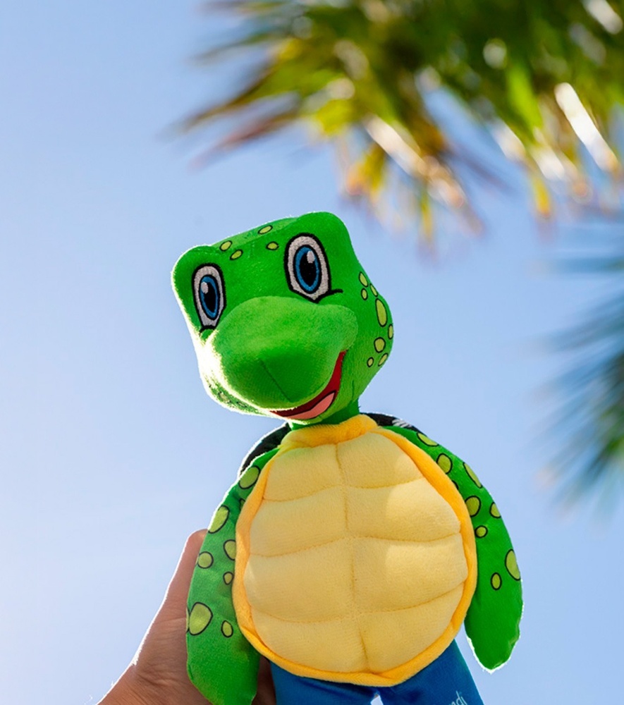 a woman in a red suit stands in front of a pool