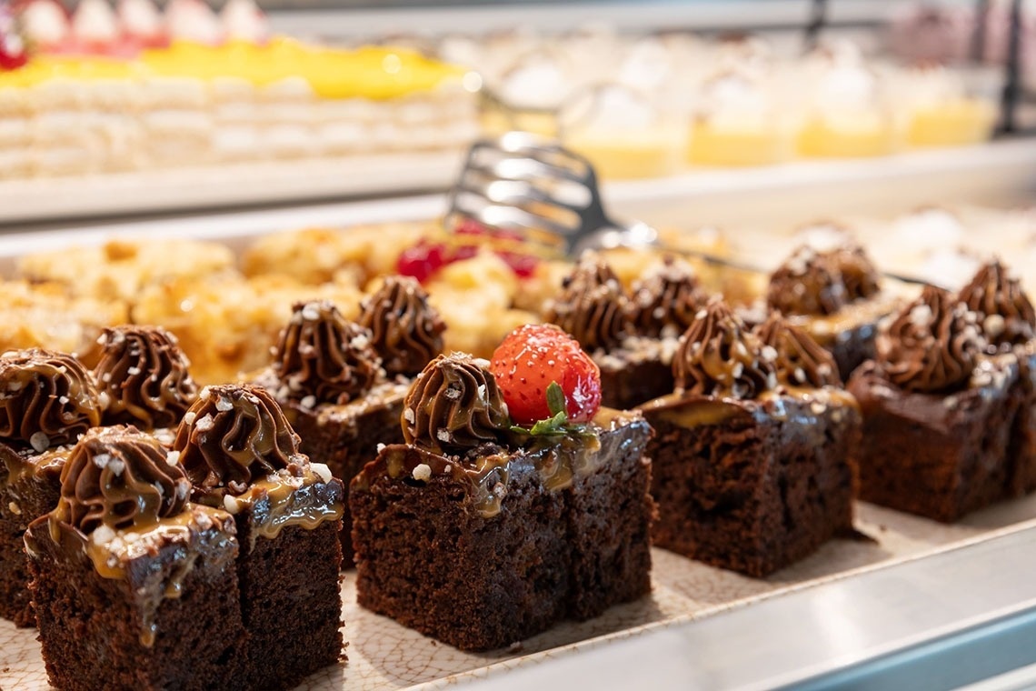 Landmar desserts: rich chocolate brownies topped with cream and strawberries.
