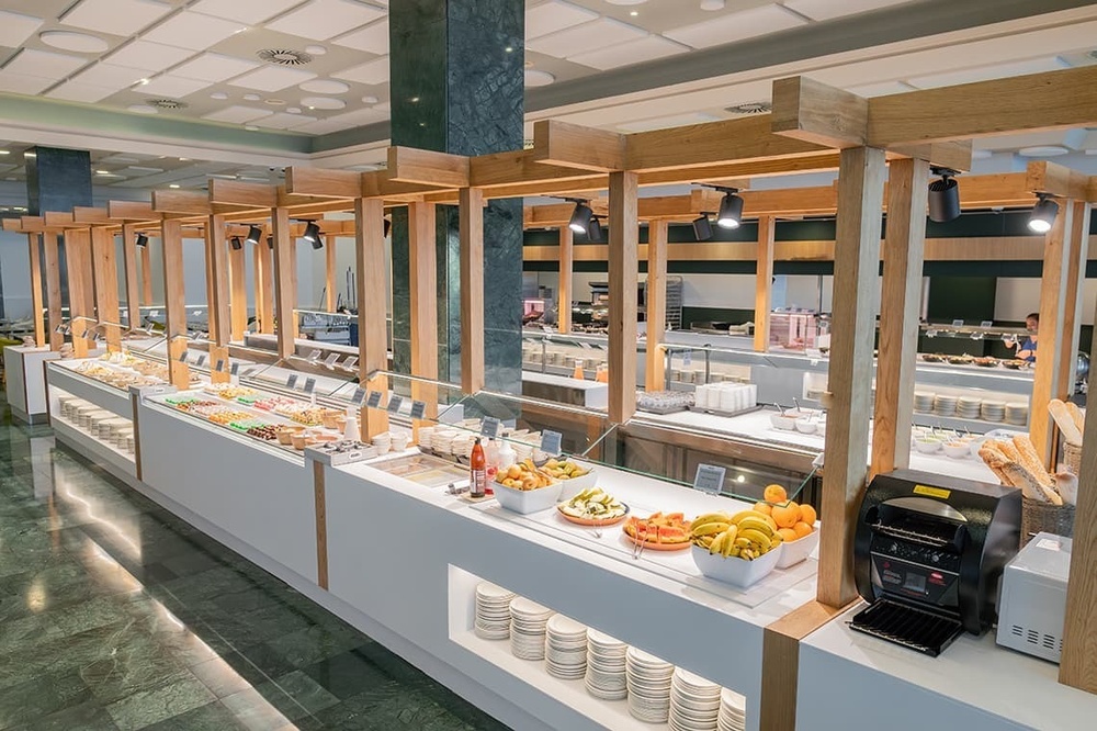 a buffet line in a restaurant with a toaster oven