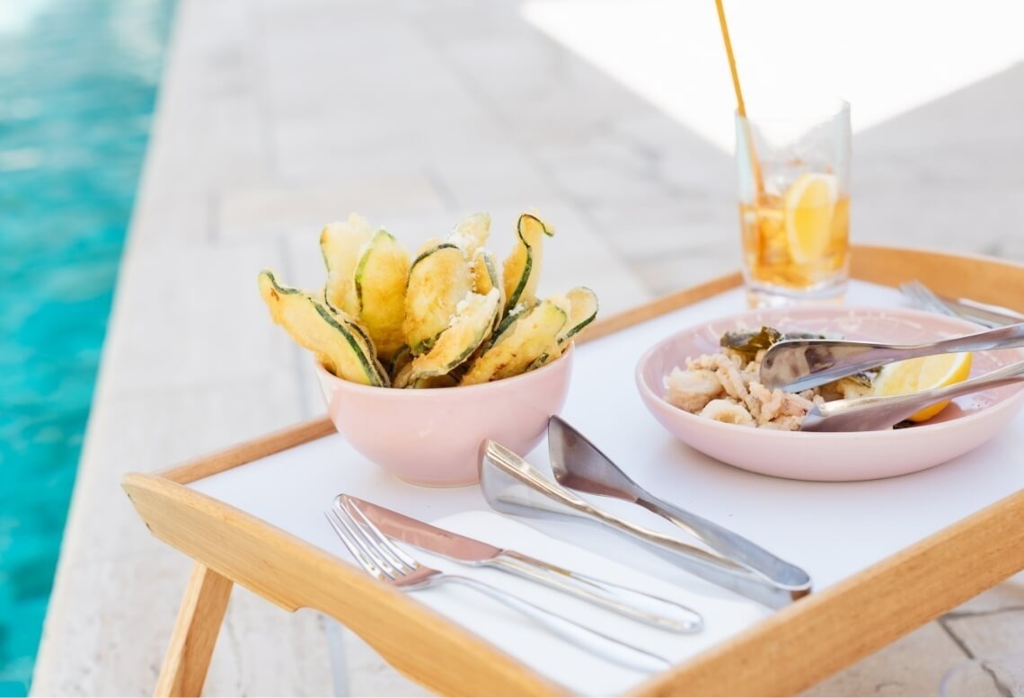 Fried fish and calamari with lemon, poolside at Landmar hotel