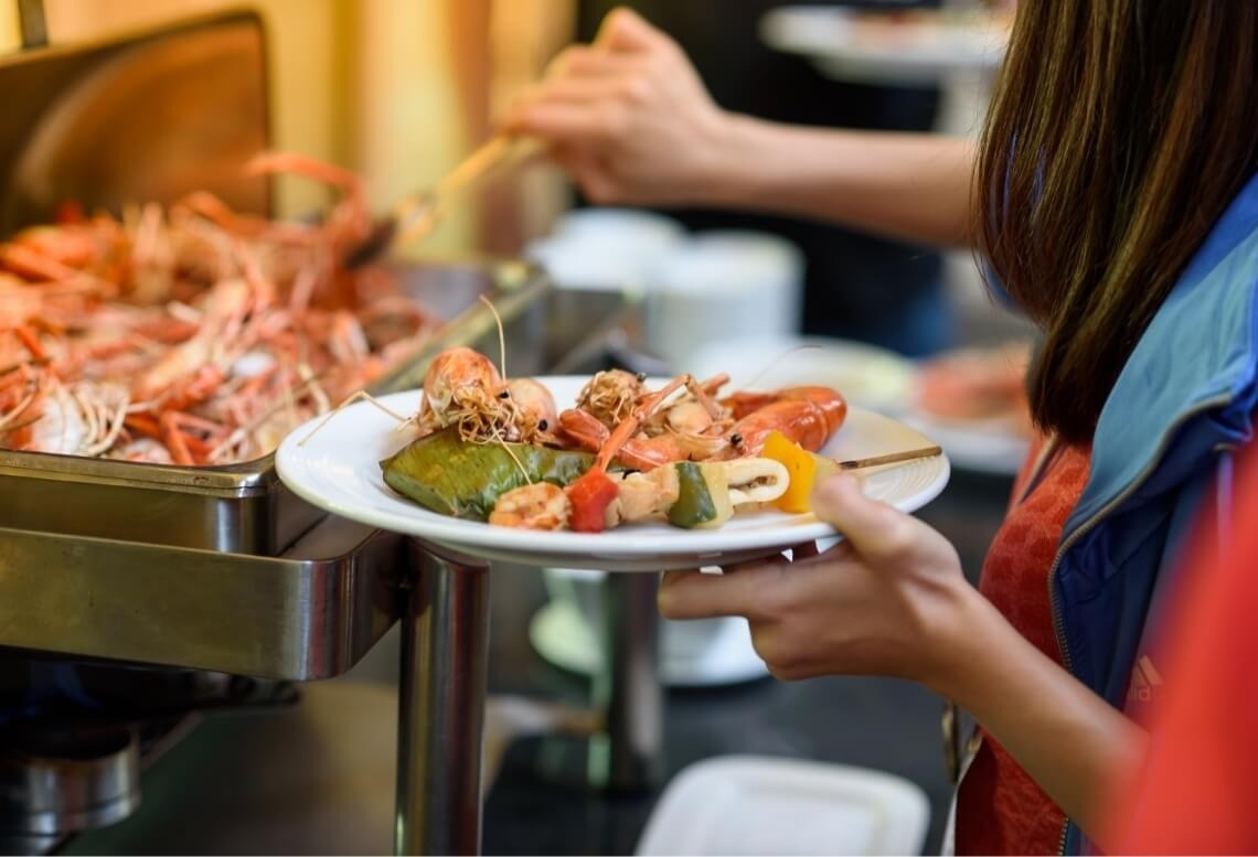 Landmar seafood buffet featuring fresh prawns and skewers.