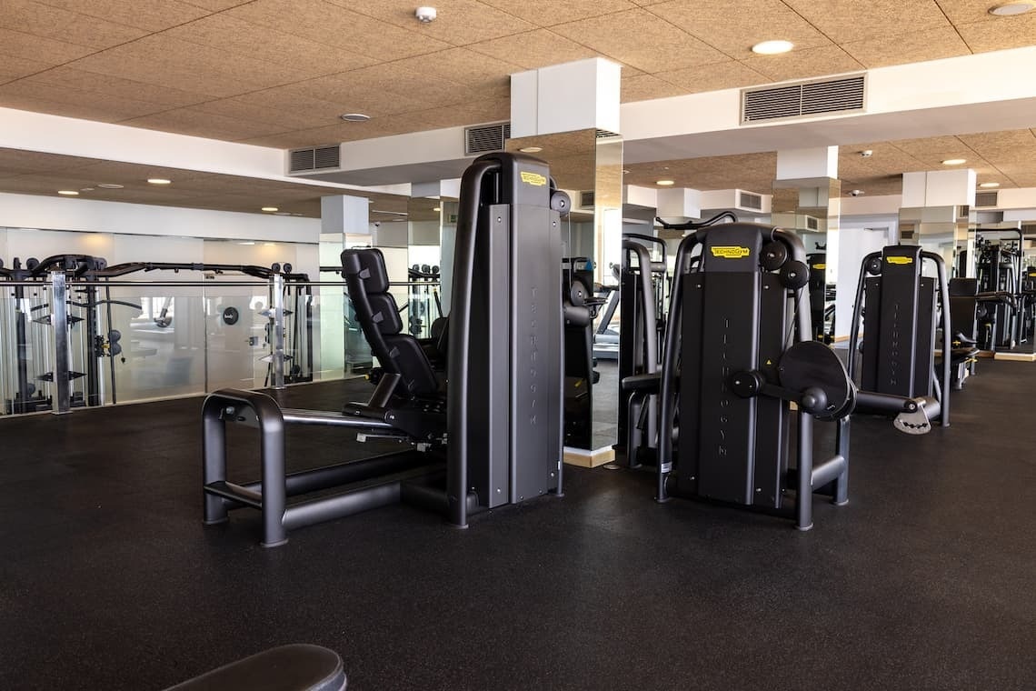 a gym with a machine that says technogym on it