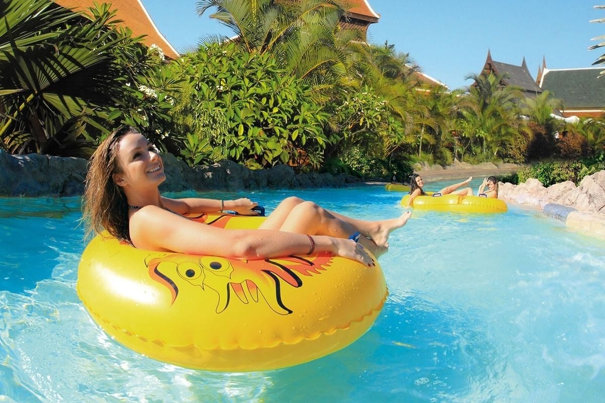 a woman in a yellow raft with the letter s on it