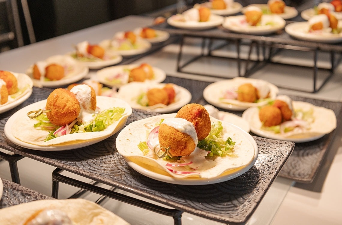 several plates of food are lined up on a table
