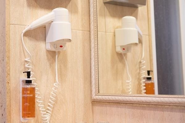 a bed with a zebra print blanket and pillows