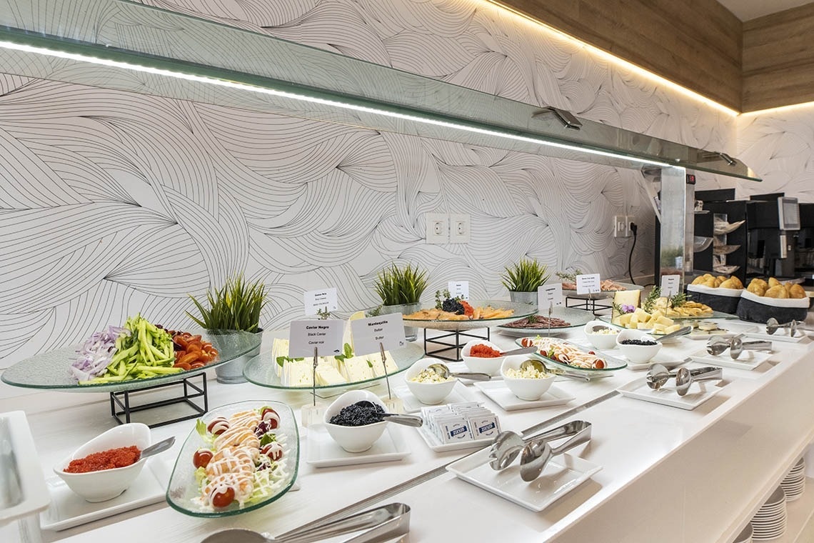 a buffet with a sign that says ' avocado ' on it