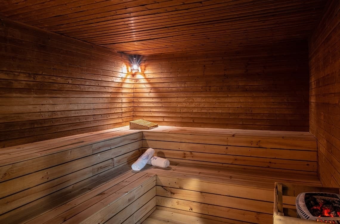 a wooden sauna with a towel that says ' finland ' on it