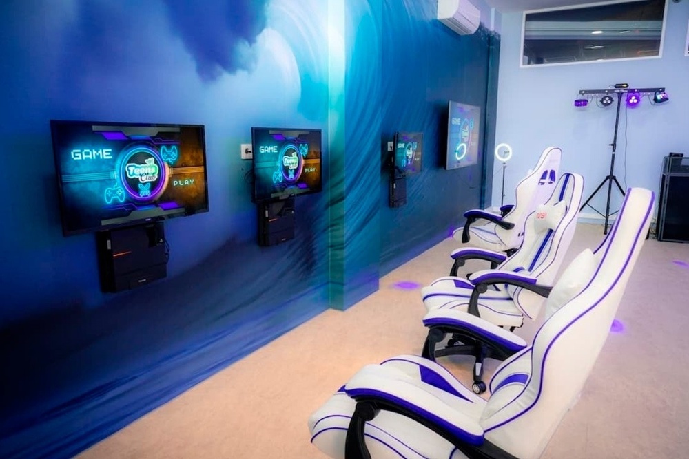 a woman in a white dress stands in front of a bush