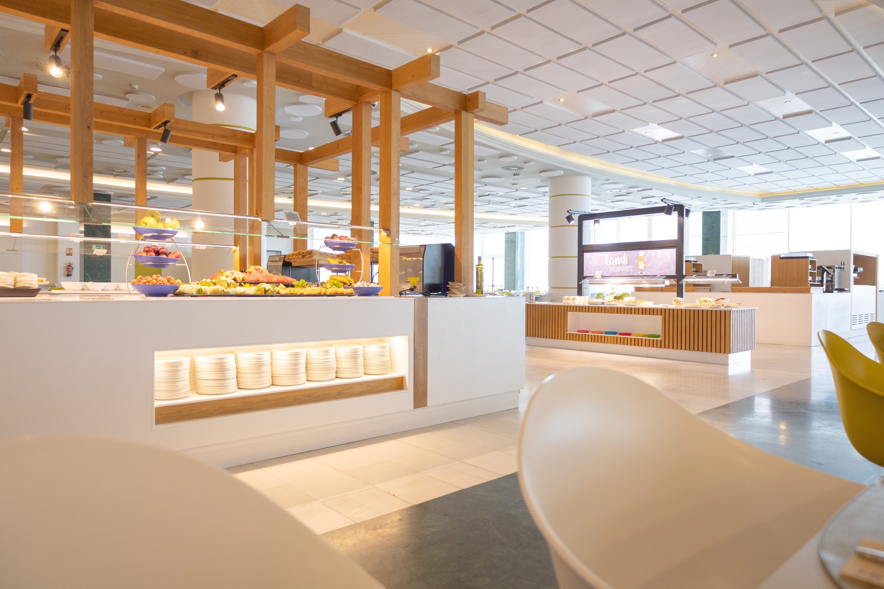 a buffet area in a restaurant with a screen that says ' king ' on it