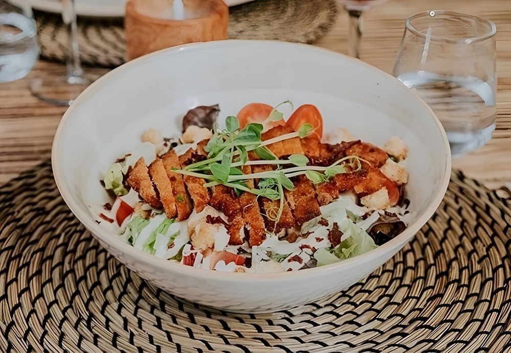 Landmar's crisp chicken Caesar salad with creamy dressing.