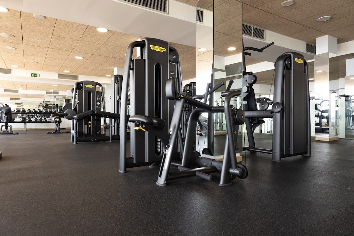 a gym with a machine that says technogym on it